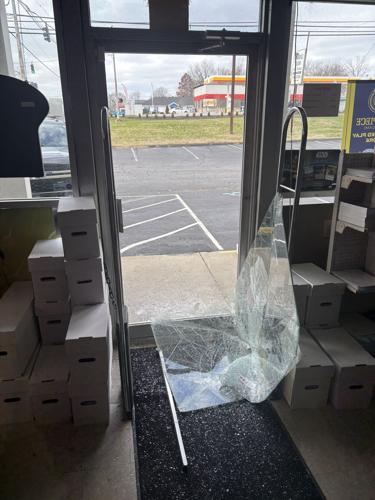 Comic Book World shattered door