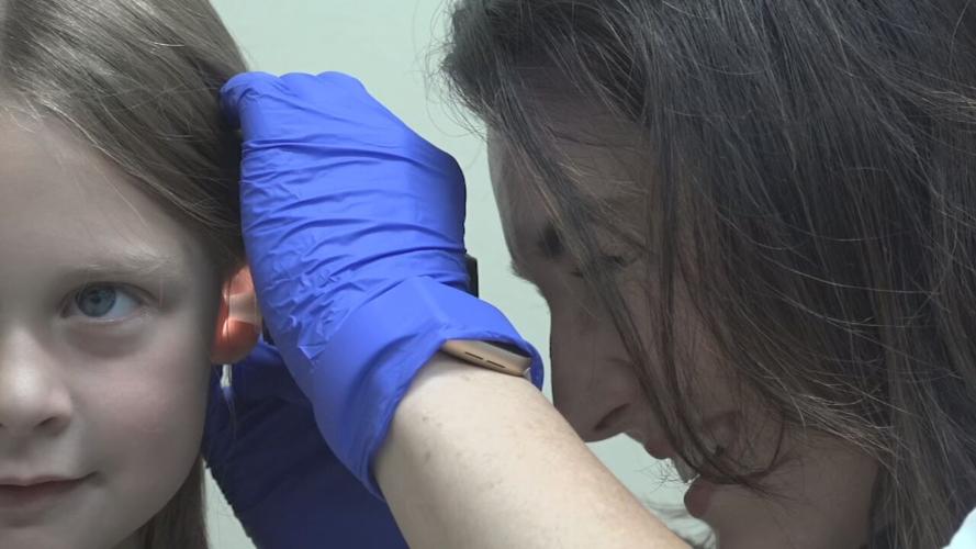 Child patient and doctor during child's annual physical