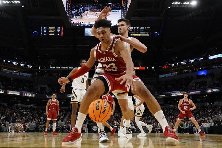 Indiana forward Trayce Jackson-Davis drives past Notre Dame forward Nate Laszewski.jpeg