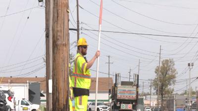 Construction worker with flagger sign in Louisville