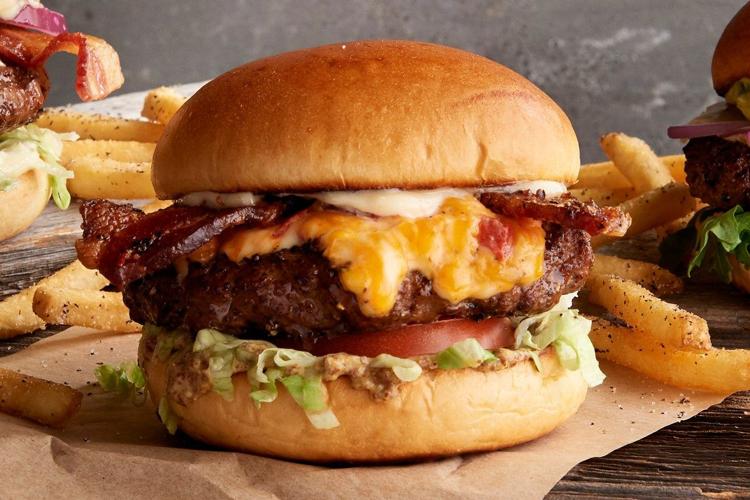 A gourmet cheeseburger from the menu of Twin Peaks sports bar