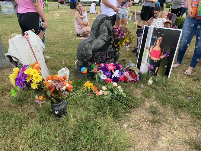 Flowers next to Savannah Duckworth's grave