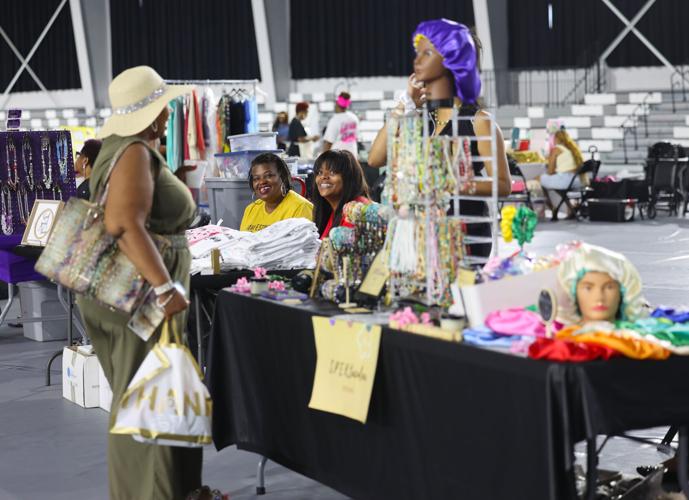 People talk to vendors at Black Business Expo.JPG