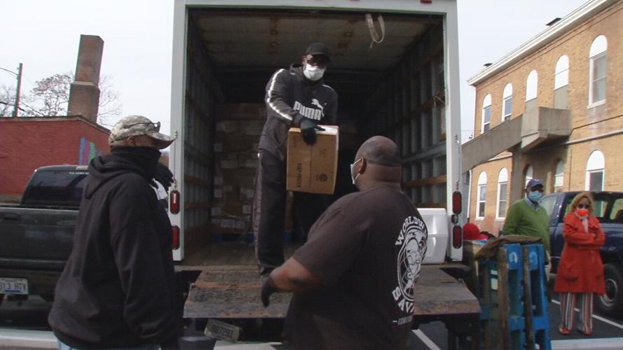 Community Connections Group giving boxes of chicken to 400 families