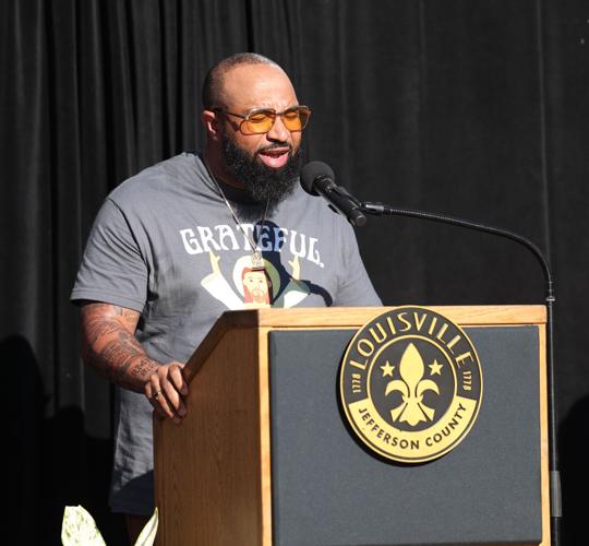 Jason Clayborn sings Amazing Grace at vigil.JPG