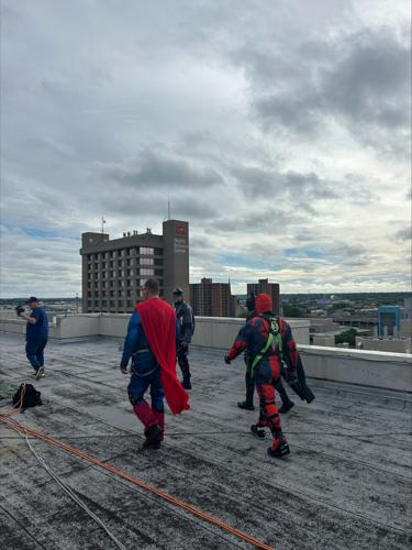 Window washers rappel from Norton Children's Hospital dressed as superheroes