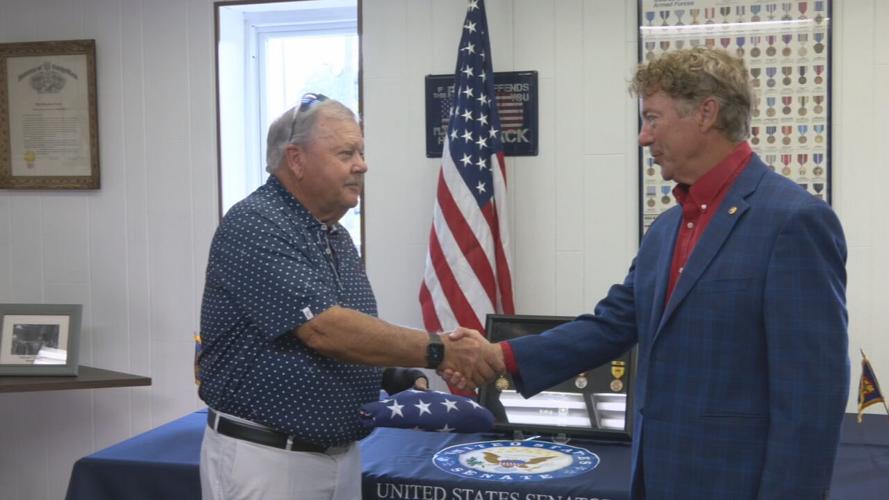Sen. Rand Paul presents an American flag to Vietnam Vet Steven Stoker