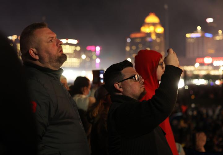 Men watch Thunder Over lOuisville.JPG