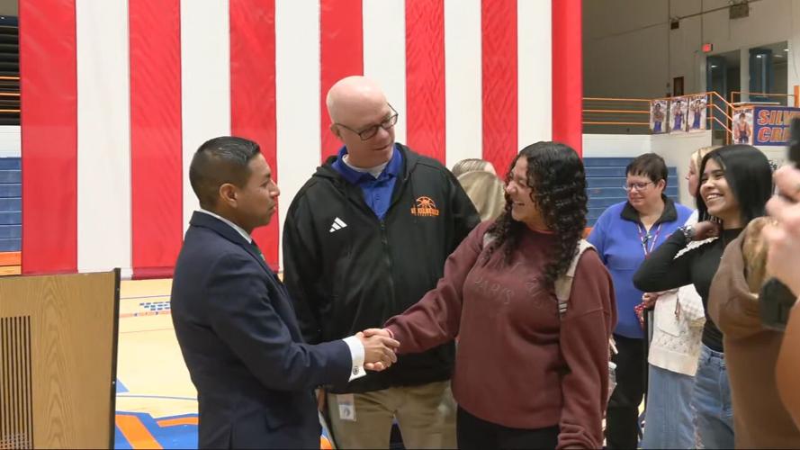 Diego Morales greets students at Silver Creek High School