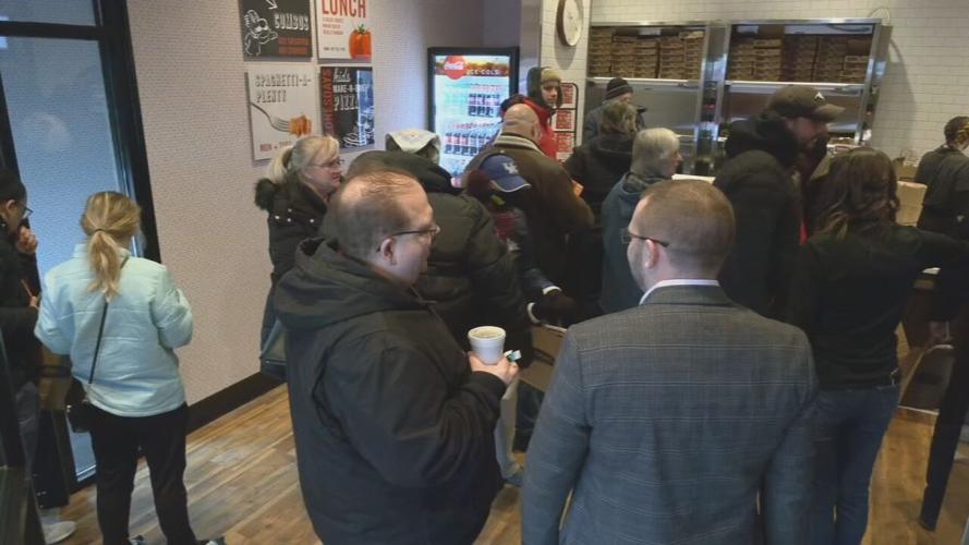 Customers waiting in line for grand opening of Louisville's first LaRosa's Pizza location
