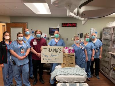 Mercy Academy Glove Donation.jpg