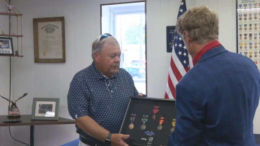 Sen. Rand Paul presents an American flag to Vietnam Vet Steven Stoker