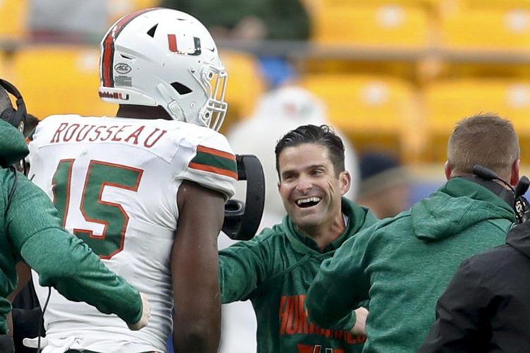 Miami defensive lineman Gregory Rousseau (15) celebrates