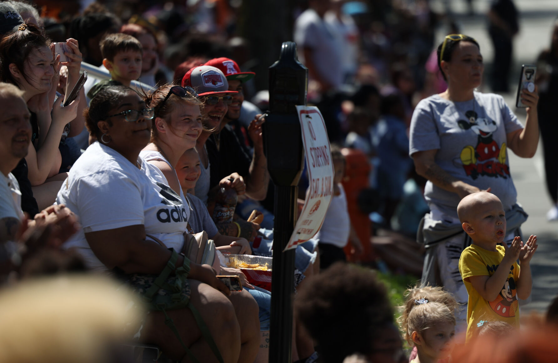 Crowd waves to marchers at the Pegasus Parade