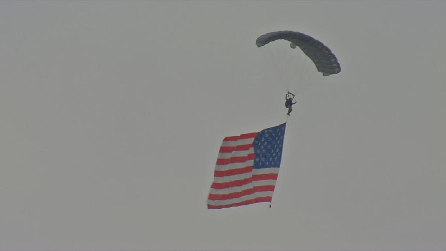 A paratrooper descend from the sky during the 2021 Thunder Over Louisville air show