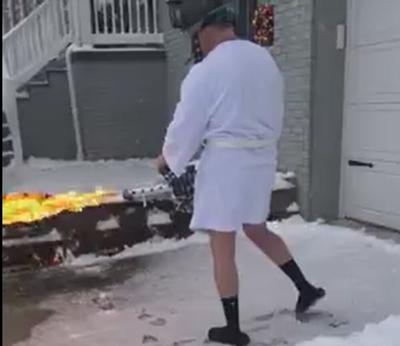 Timothy Browning of Ashland, Kentucky, clears driveway with flamethrower (Dec. 2020)