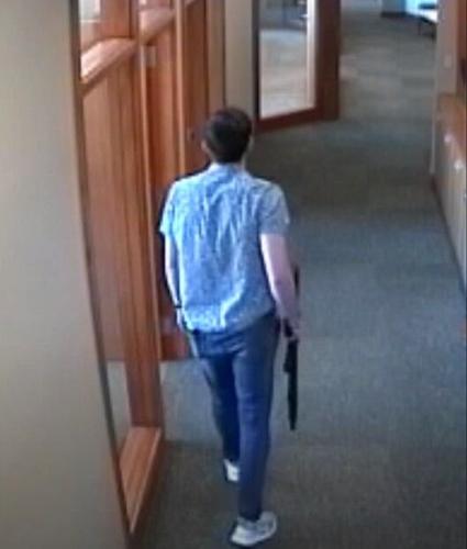 Connor Sturgeon on surveillance video with rifle in corridor of Old National Bank