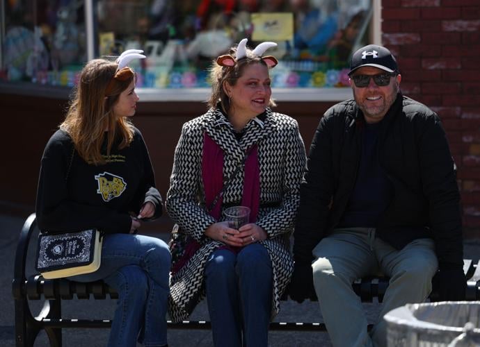 Three people sit down at Bock Fest.JPG