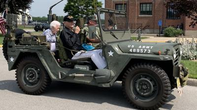 World War II veteran takes a ride in a military Jeep restored by KILROY 78 years after D-Day