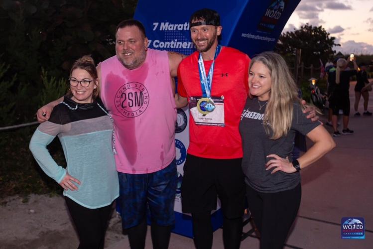 Corey Burton with family and friends after completing race.jpg