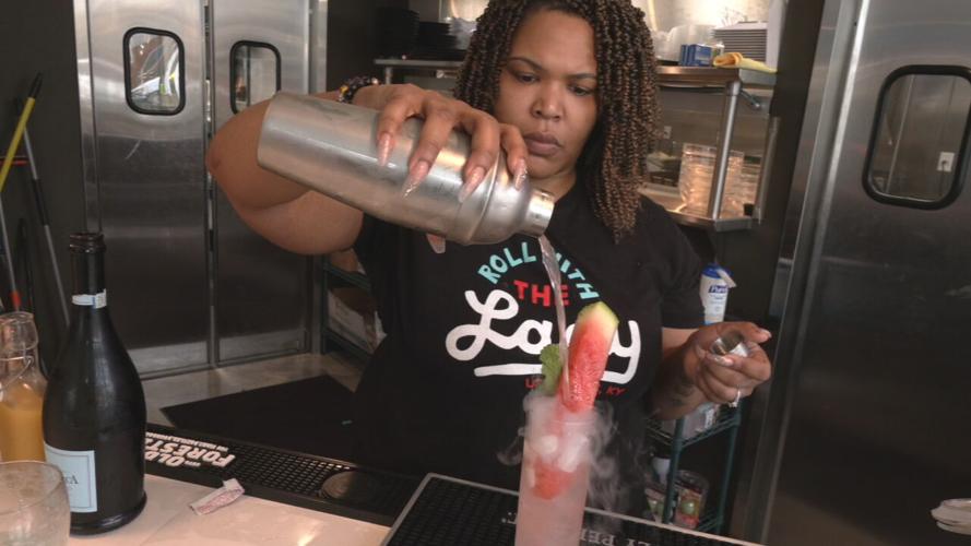 Nichelle Thurston makes drink at Seafood Lady