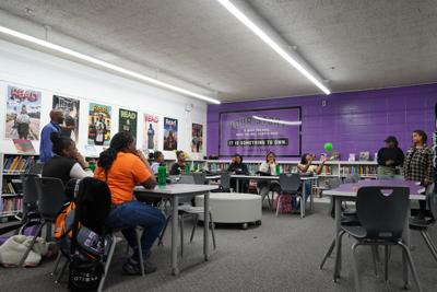 Female Scholars and facilitators play an ice-breaking game during the first Group Mentoring session at Hudson Middle School.