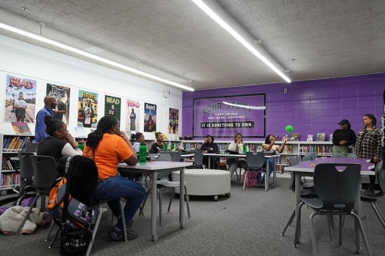 Female Scholars and facilitators play an ice-breaking game during the first Group Mentoring session at Hudson Middle School.
