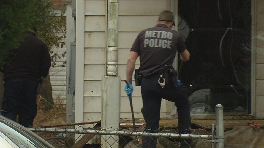 Louisville Metro Police search an abandoned property on Elliott Avenue on Jan. 30, 2019