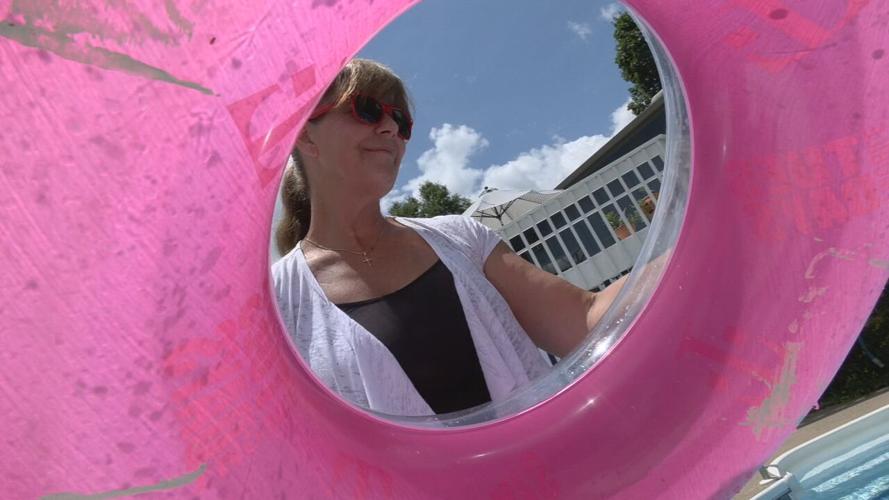 Pool owner Shawn Allyn inflates inner tube