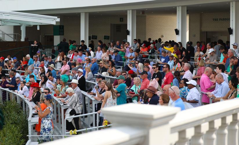 People watch at the Paddock Club.JPG