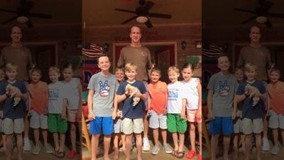 Retired NFL quarterback Peyton Manning adopts abused rescue dog