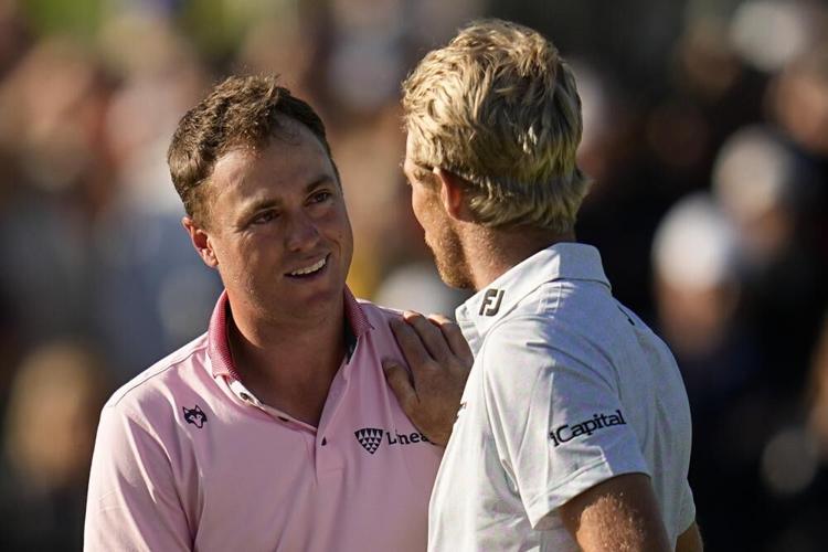 Justin Thomas is greeted by Will Zalatoris.jpeg