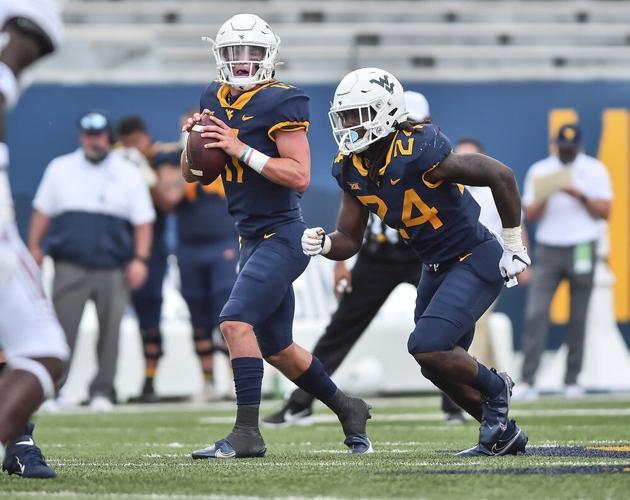 West Virginia quarterback Garrett Greene looks to pass