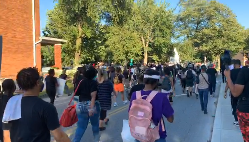 Protesters march in the area of Churchill Downs on Derby day
