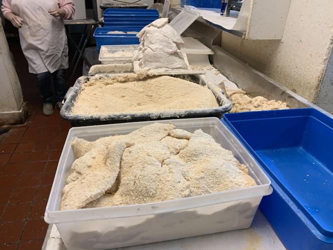 The Hungry Pelican prepares fish