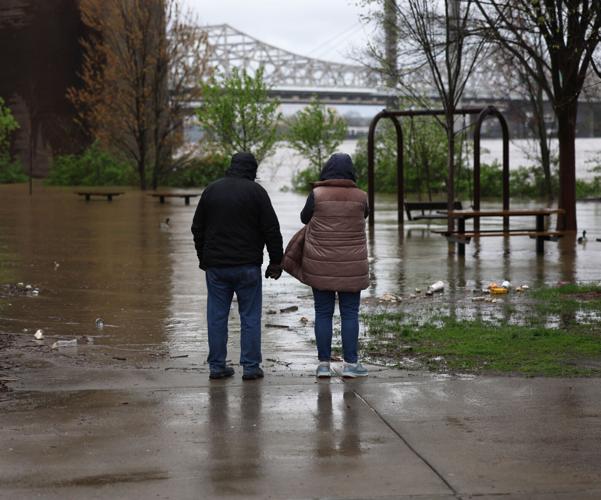 Couple looks at flooding at Big Four Bridge - April 6.JPG