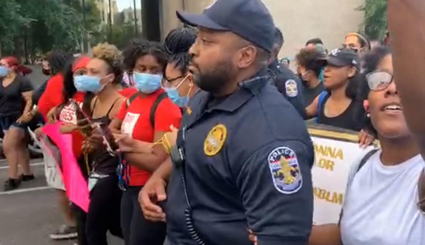 Protesters and police link arms (3) 6-1-20