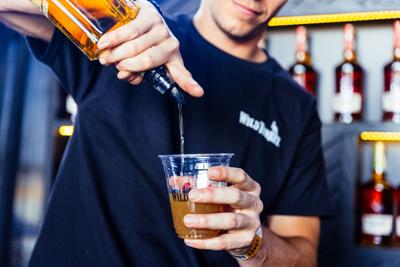 Bartender pours a drink at Bourbon & Beyond at Kentucky Expo Center