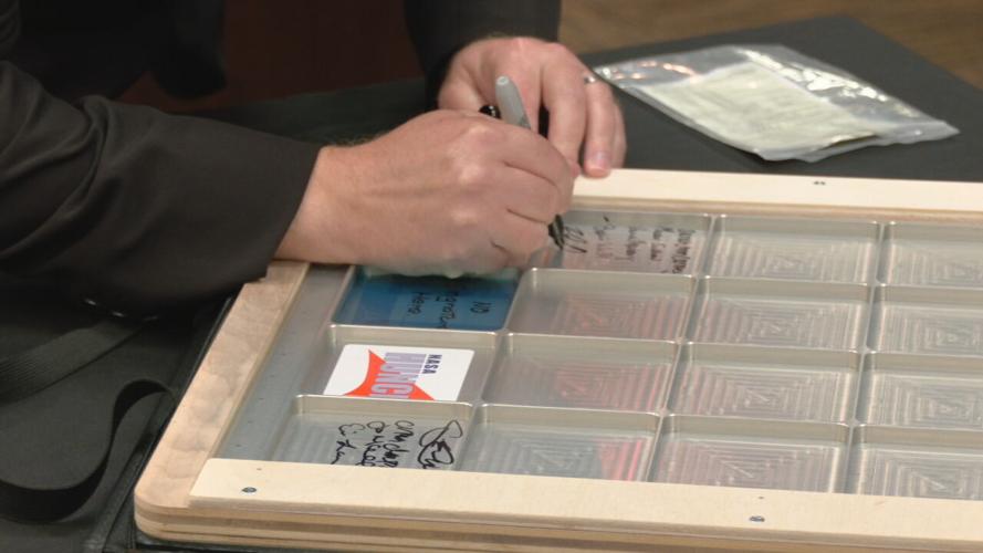 Chefs from the Sullivan University's culinary school signed a NASA locker that will be flown to the International Space Station