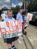 IMAGES | Saint Francis of Assisi middle schoolers hold anti-violence march