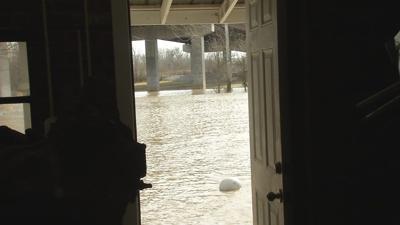 Waterfront homeowners say Lewis and Clark Bridge makes flooding problem worse