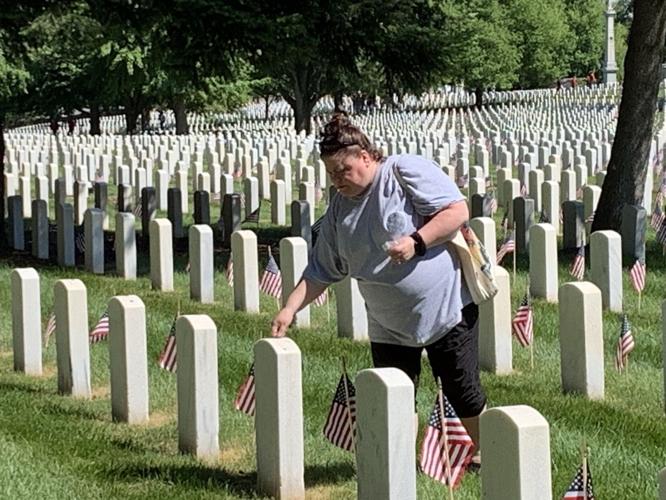 Placing pennies on Memorial Day at Zachary Taylor Cemetery