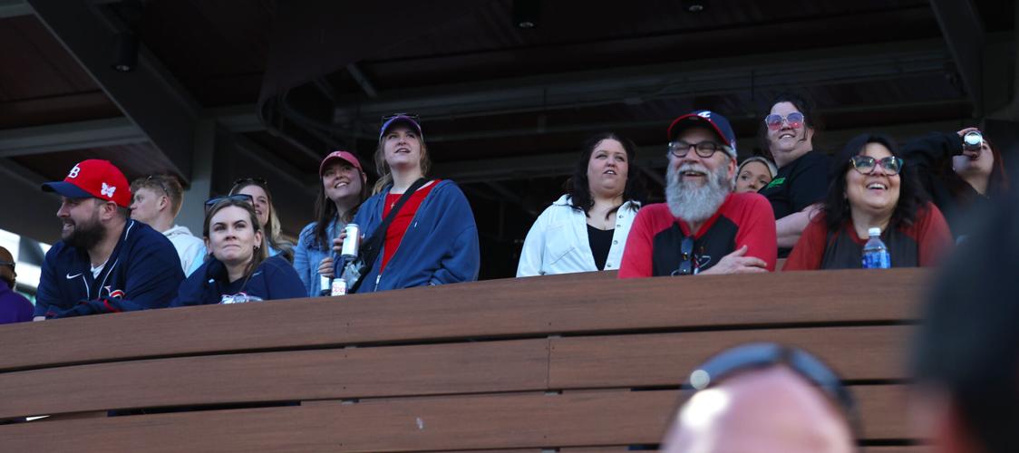 Fans in left field watch Bats game.JPG
