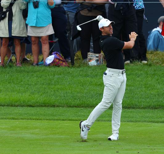 Rory McIlroy finishes his swing on fairway.JPG