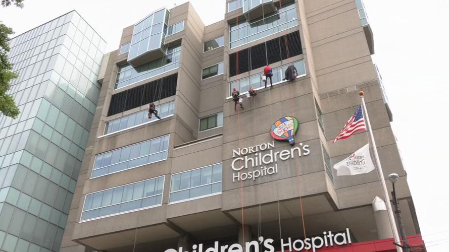 Window washers rappel from Norton Children's Hospital dressed as superheroes