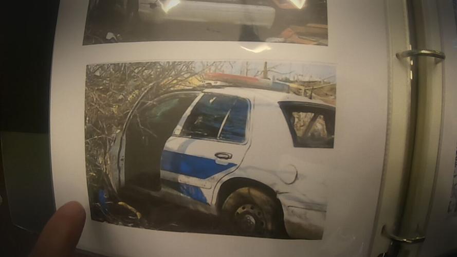 Cop car through Dietrich's basement.jpeg