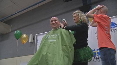 Father and son shave heads for St. Baldrick's Foundation