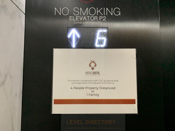 Hotel Distil elevator capacity sign
