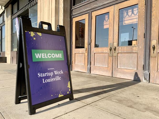 Startup Week Louisville sign on sidewalk