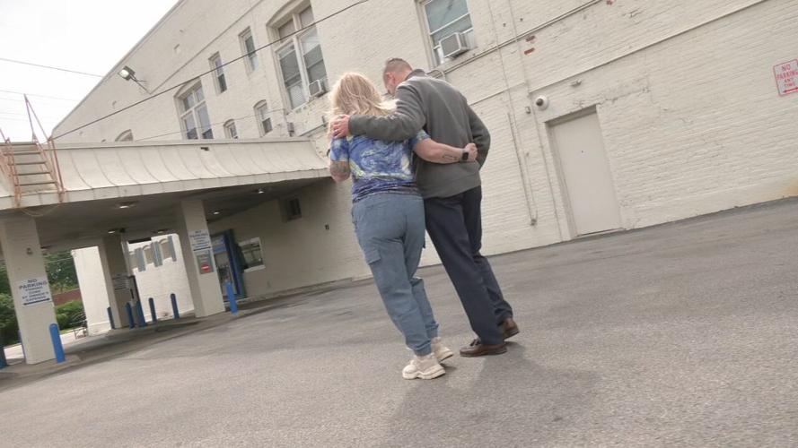 Dawn Simpson and Alan Stone walk through the drive-thru of Chase Bank on Bardstown Road